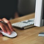 woman working on desktop computer
