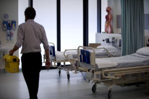 Find out more about Monash Medical School man walking in hospital room
