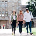 university of queensland students walking on campus