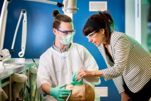 Learn more about Melbourne Dental School University of Melbourne Dental School student with simulation dummy