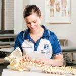 university of melbourne physiotherapy student with skeletal model