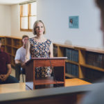 UWA Law School student standing at podium in moot court