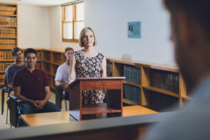 Find out more about UWA Law School UWA Law School student standing at podium in moot court