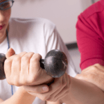 occupational therapist working with client to strengthen wrist