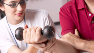 occupational therapist working with client to strengthen wrist