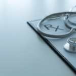 stethoscope on prescription pad