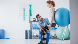 Learn more about Australian physio degrees physiotherapist working with patient with ball