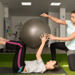physiotherapist working with patient