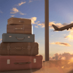 stacked suitcases and airplane