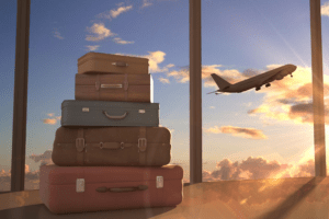 Learn more about getting ready to go! stacked suitcases and airplane