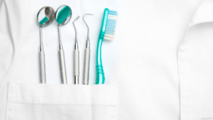 lab coat with dentistry tools in pocket