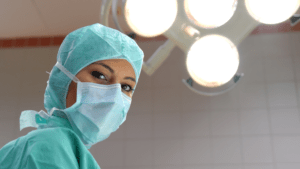Learn more about Australian medical schools doctor wearing scrubs and mask in operating room