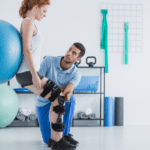 physiotherapist working with patient