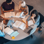 students studying around a table