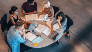 Learn more about what you can study at Australian universities students studying around a table