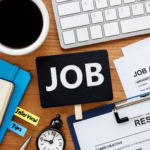 cluttered desk with resume
