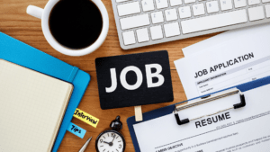 cluttered desk with resume