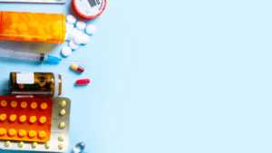 Learn more about becoming a licensed pharmacist pharmaceutical pills on blue background