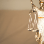 gold lady justice holding scales of justice