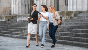 Learn more about studying law at Macquarie law students walking on steps of building